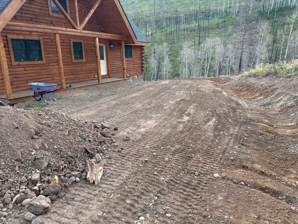 Defensible Space in Conifer - CO underway as a crew clears brush around a mountain home